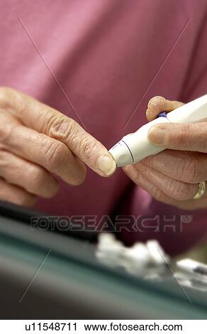 Woman checking blood sugar View Large Photo Image Stock Image - Woman checking blood sugar. Fotosearch
