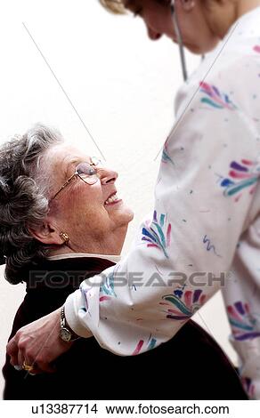 Woman having a medical checkup View Large Photo Image Picture - Woman having a medical checkup. Fotosearch