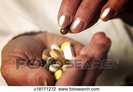 Woman taking pills View Large Photo Image Stock Image - Woman taking pills. Fotosearch