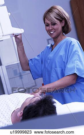 Xray tech taking xrays View Large Photo Image Stock Image - Xray tech taking xrays. Fotosearch