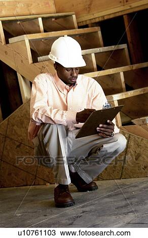 Stock Image - African American construction manager on site. Fotosearch