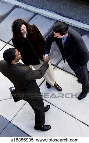 Businesspeople on sidewalk View Large Photo Image Stock Photography - Businesspeople on sidewalk. Fotosearch