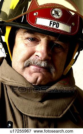 Fireman in uniform View Large Photo Image Stock Photo - Fireman in uniform. Fotosearch