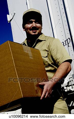 Man delivering packages View Large Photo Image Picture - Man delivering packages. Fotosearch