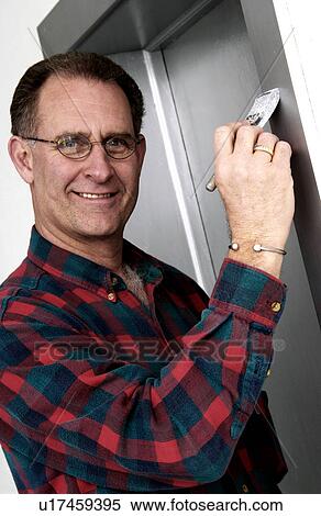 Stock Photography - Man painting. Fotosearch