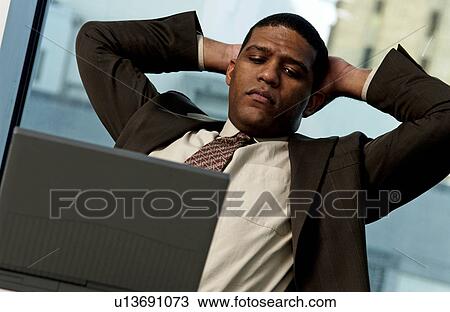 Man working on laptop View Large Photo Image Stock Image - Man working on laptop. Fotosearch