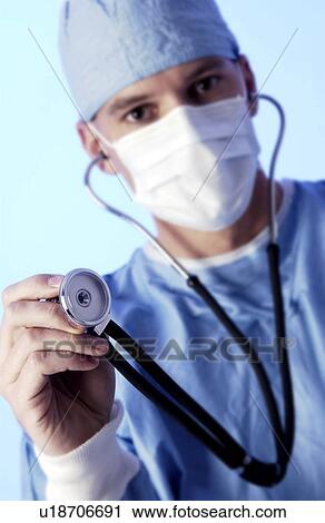 Physician holding stethoscope View Large Photo Image Stock Image - Physician holding stethoscope. Fotosearch
