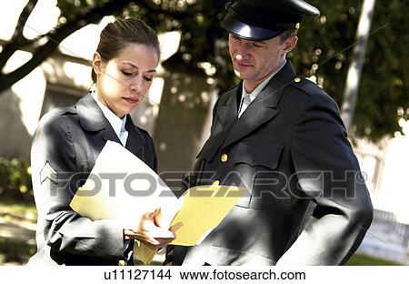 Army personnel discussing file View Large Photo Image Picture - Army personnel discussing file. Fotosearch