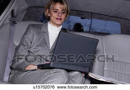 Businesswoman in limousine View Large Photo Image Stock Photograph - Businesswoman in limousine. Fotosearch