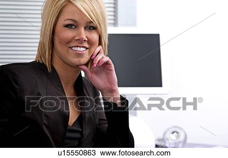 Businesswoman in office environment View Large Photo Image Stock Image - Businesswoman in office environment. Fotosearch