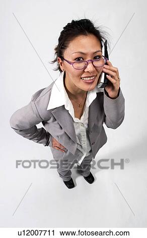 Businesswoman on cell phone View Large Photo Image Stock Image - Businesswoman on cell phone. Fotosearch