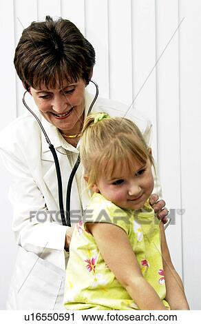 Doctor examining child View Large Photo Image Stock Image - Doctor examining child. Fotosearch