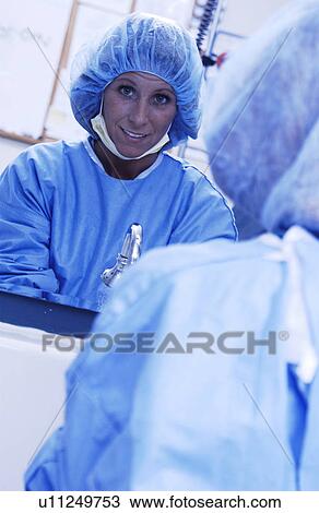 Nurse sanitizing hands before surgery View Large Photo Image Stock Image - Nurse sanitizing hands before surgery. Fotosearch