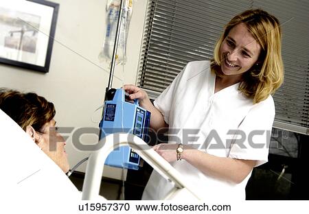 Nurse with patient setting up IV View Large Photo Image Stock Image - Nurse with patient setting up IV. Fotosearch