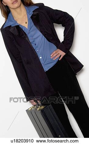 Stock Image - Woman holding briefcase. Fotosearch