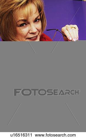 Woman sitting in chair View Large Photo Image Stock Image - Woman sitting in chair. Fotosearch
