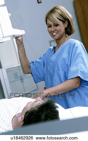 Xray tech taking xrays View Large Photo Image Stock Photograph - Xray tech taking xrays. Fotosearch