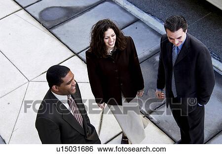 Stock Photograph - Businesspeople walking on sidewalk. Fotosearch