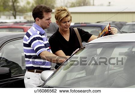 Couple car shopping View Large Photo Image Stock Image - Couple car shopping. Fotosearch