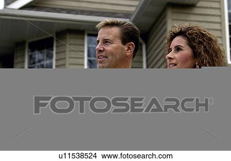 Couple looking at house plans View Large Photo Image Picture - Couple looking at house plans. Fotosearch