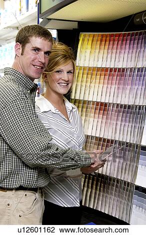Couple looking at paint samples View Large Photo Image Stock Image - Couple looking at paint samples. Fotosearch