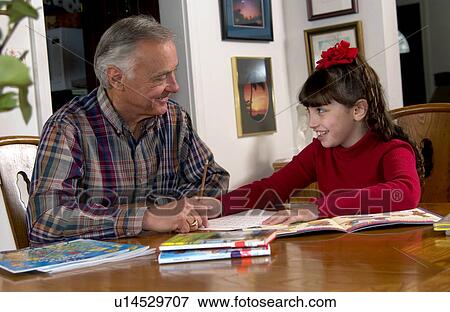 Grandpa helping granddaughter with homework View Large Photo Image Stock Photo - Grandpa helping granddaughter with homework. Fotosearch