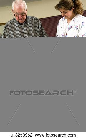 Stock Image - Man in physical rehabilitation. Fotosearch