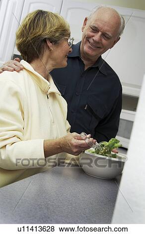 Senior couple in kitchen View Large Photo Image Stock Photo - Senior couple in kitchen. Fotosearch