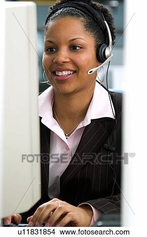Picture - African American woman at computer. Fotosearch