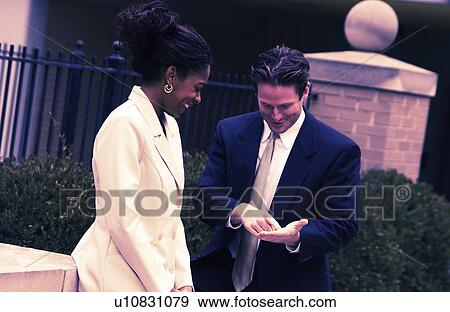 Business people having a conversation View Large Photo Image Stock Photo - Business people having a conversation. Fotosearch