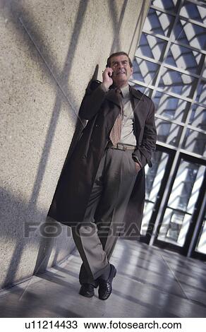 Stock Image - Businessman on cell phone. Fotosearch