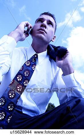 Picture - Businessman talking on cell phone. Fotosearch