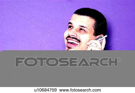Stock Photo - Businessman talking on cell phone. Fotosearch