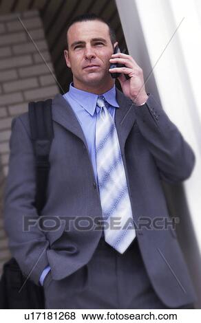 Businessman talking on cell phone View Large Photo Image Stock Photo - Businessman talking on cell phone. Fotosearch