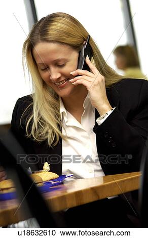 Stock Image - Businesswoman on cell phone. Fotosearch