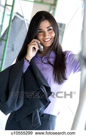 Stock Photo - Businesswoman on cell phone. Fotosearch