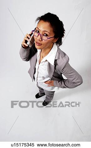 Businesswoman on cell phone View Large Photo Image Stock Photography - Businesswoman on cell phone. Fotosearch