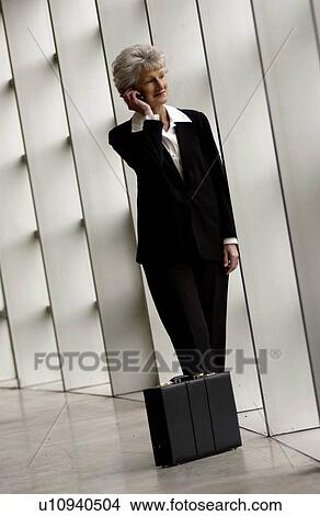 Businesswoman talking on cell phone View Large Photo Image Picture - Businesswoman talking on cell phone. Fotosearch
