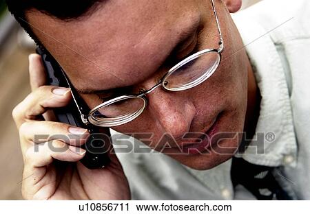 Stock Image - Man on phone. Fotosearch