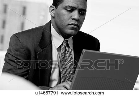 Man working on laptop View Large Photo Image Stock Image - Man working on laptop. Fotosearch