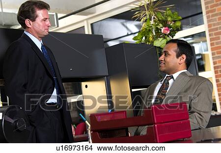 Two men working in office View Large Photo Image Picture - Two men working in office. Fotosearch