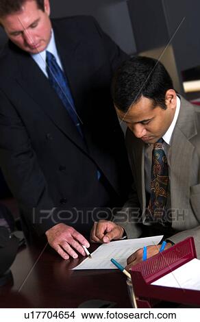 Two men working in office View Large Photo Image Picture - Two men working in office. Fotosearch