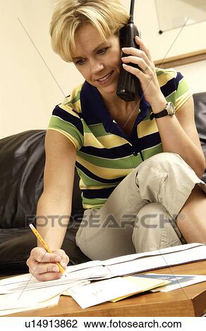 Stock Image - Woman talking on phone. Fotosearch