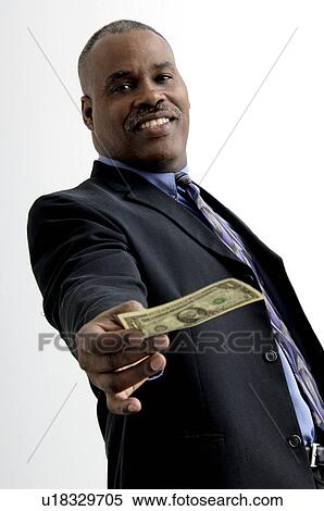 Stock Photography - Businessman holding money. Fotosearch