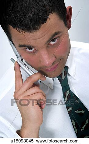 Stock Photography - Businessman on cell phone. Fotosearch