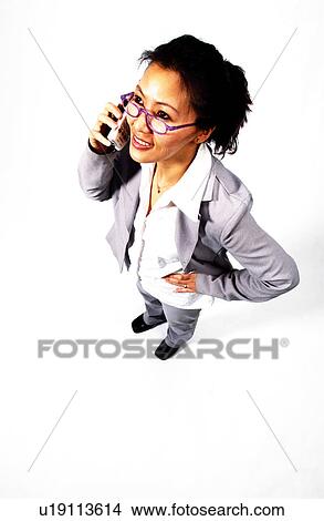 Picture - Businesswoman on cell phone. Fotosearch