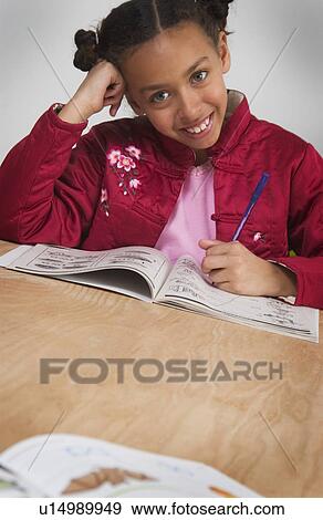 African American girl doing homework View Large Photo Image Stock Photo - African American girl doing homework. Fotosearch