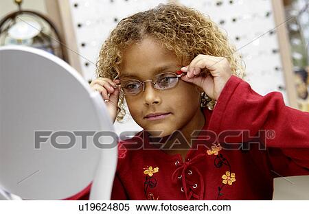 African American girl trying on glasses View Large Photo Image Stock Photography - African American girl trying on glasses. Fotosearch