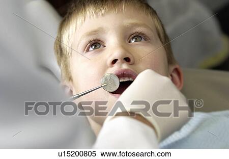 Boy getting dental exam View Large Photo Image Stock Photography - Boy getting dental exam. Fotosearch