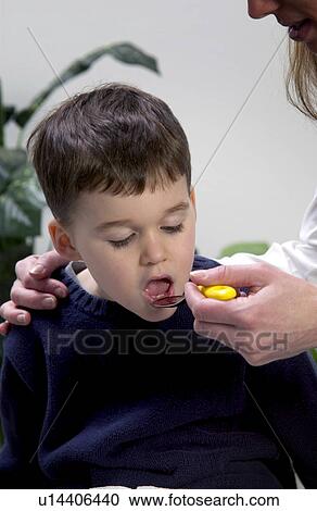 Boy taking medicine View Large Photo Image Stock Image - Boy taking medicine. Fotosearch